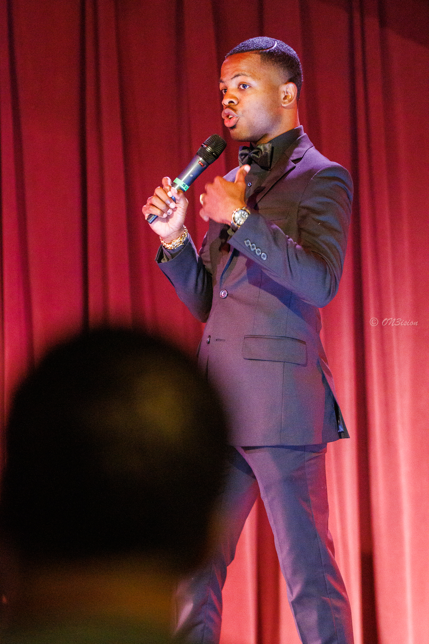 Brother Ben X speaking on stage